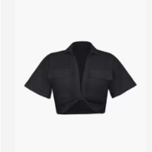 Flap pocket twist hem black crop top. NWOT.